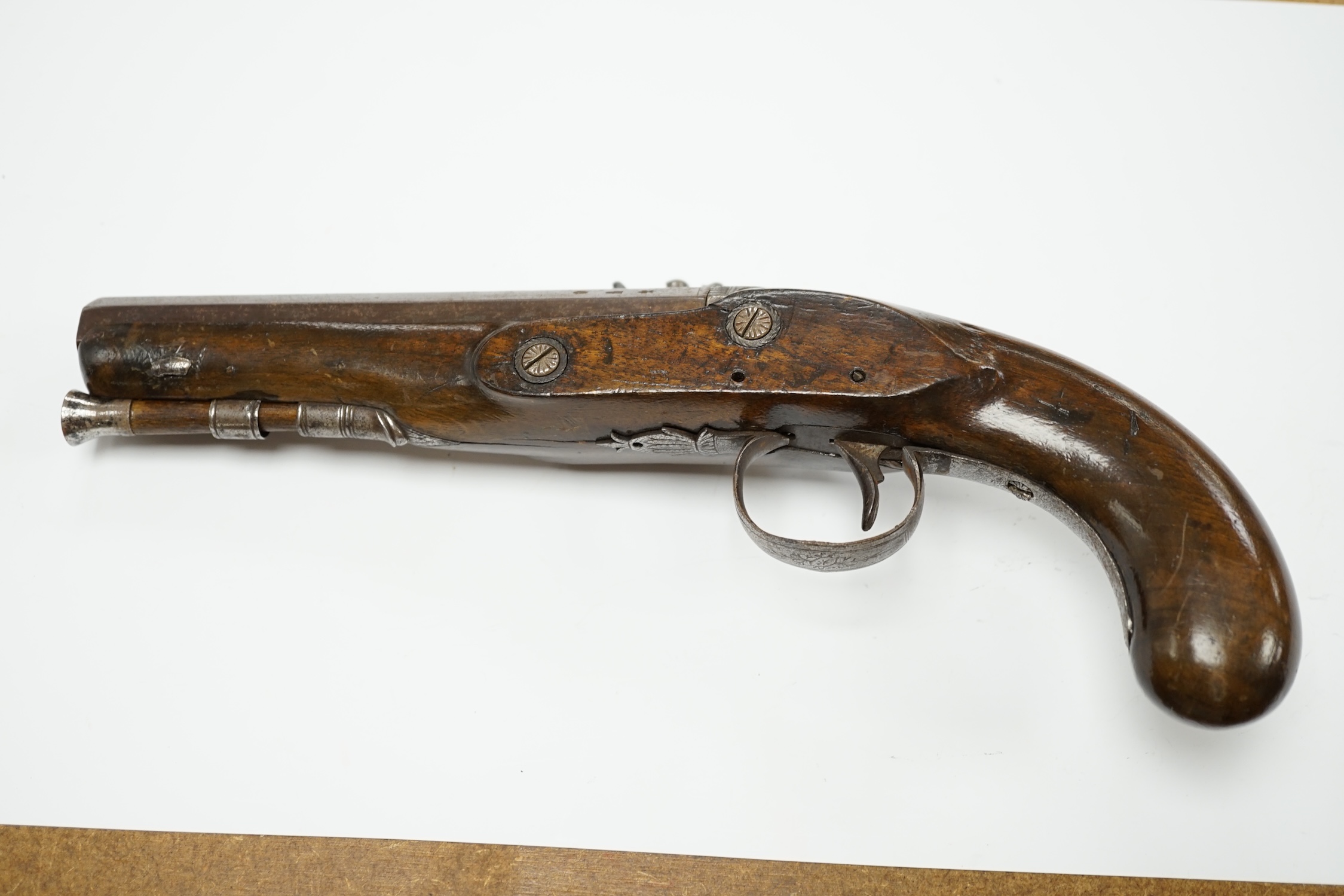 An early 19th century 12 bore fully stocked flintlock holster pistol, octagonal barrel with Birmingham proof marks, engraved iron trigger guard, iron tipped wooden ramrod, barrel 15.5cm. Condition - fair, cock replaced,